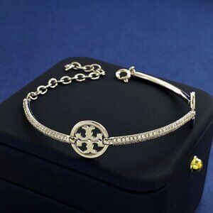 Tory Burch's new, stylish, polished, round Double T logo bracelet with diamonds